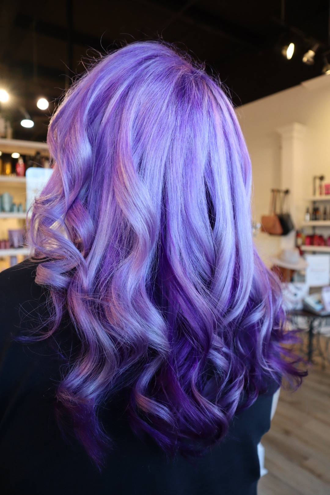 Layered cut with a bouncy blowout finish — hair by Lili Barker in Leander, TX