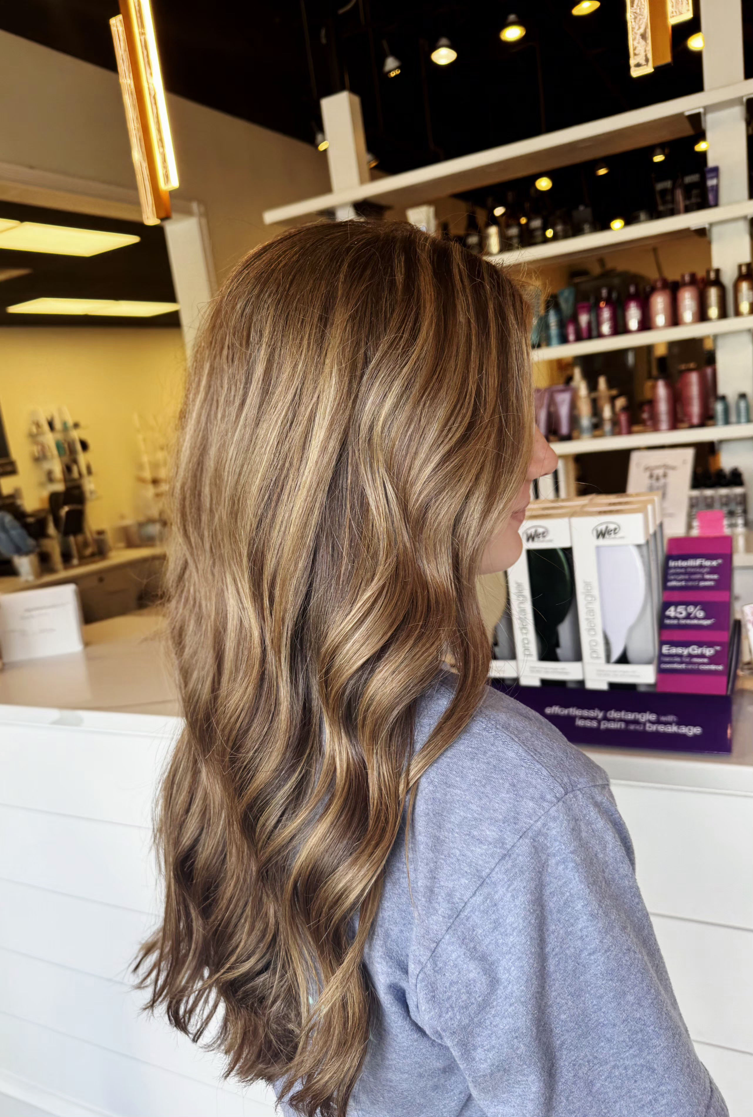 Full highlight and toner, styled in loose waves — hair by Lili Barker in Leander, TX