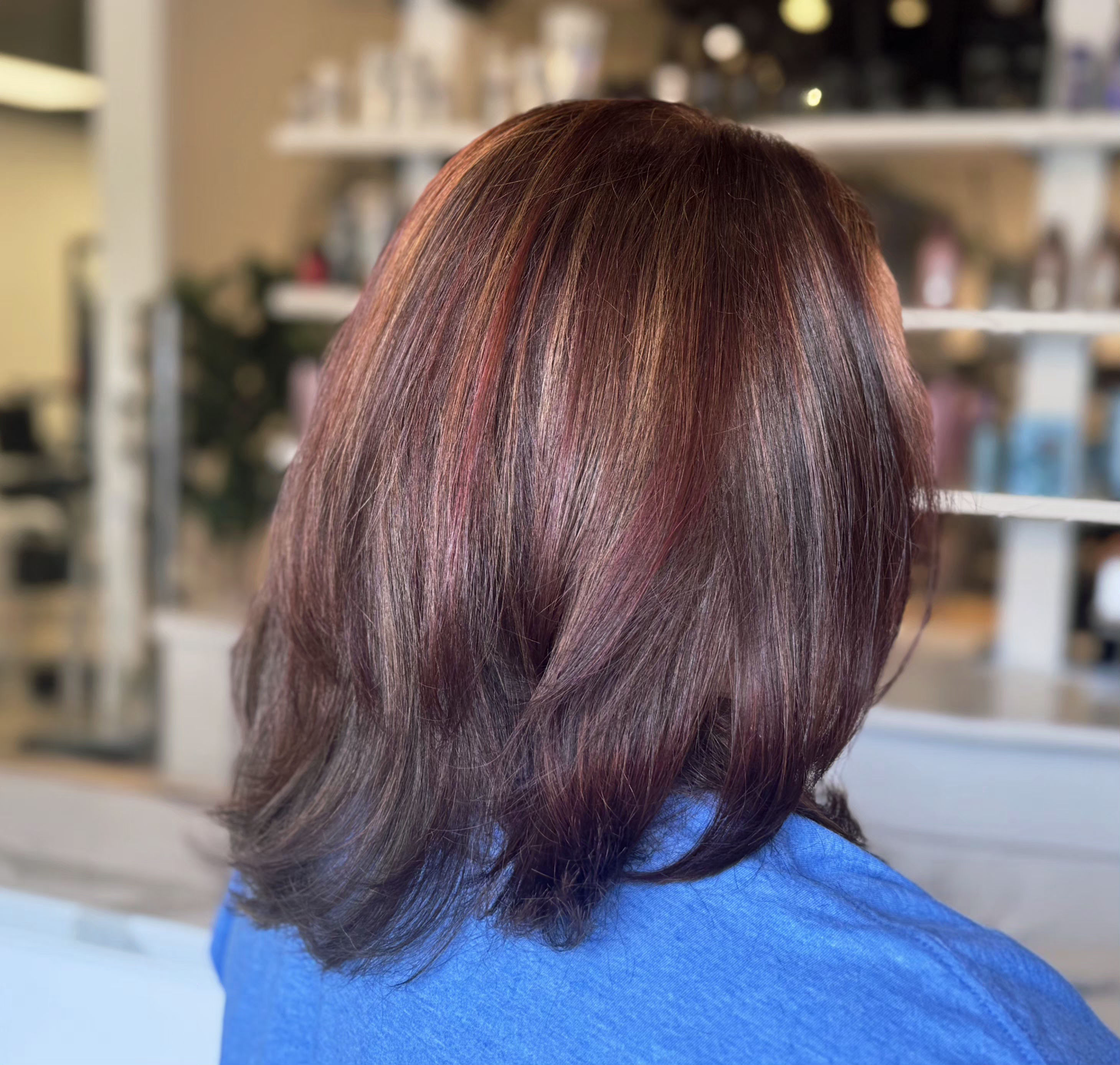 Dimensional blonde highlights finished with a gloss — hair by Lili Barker in Leander, TX