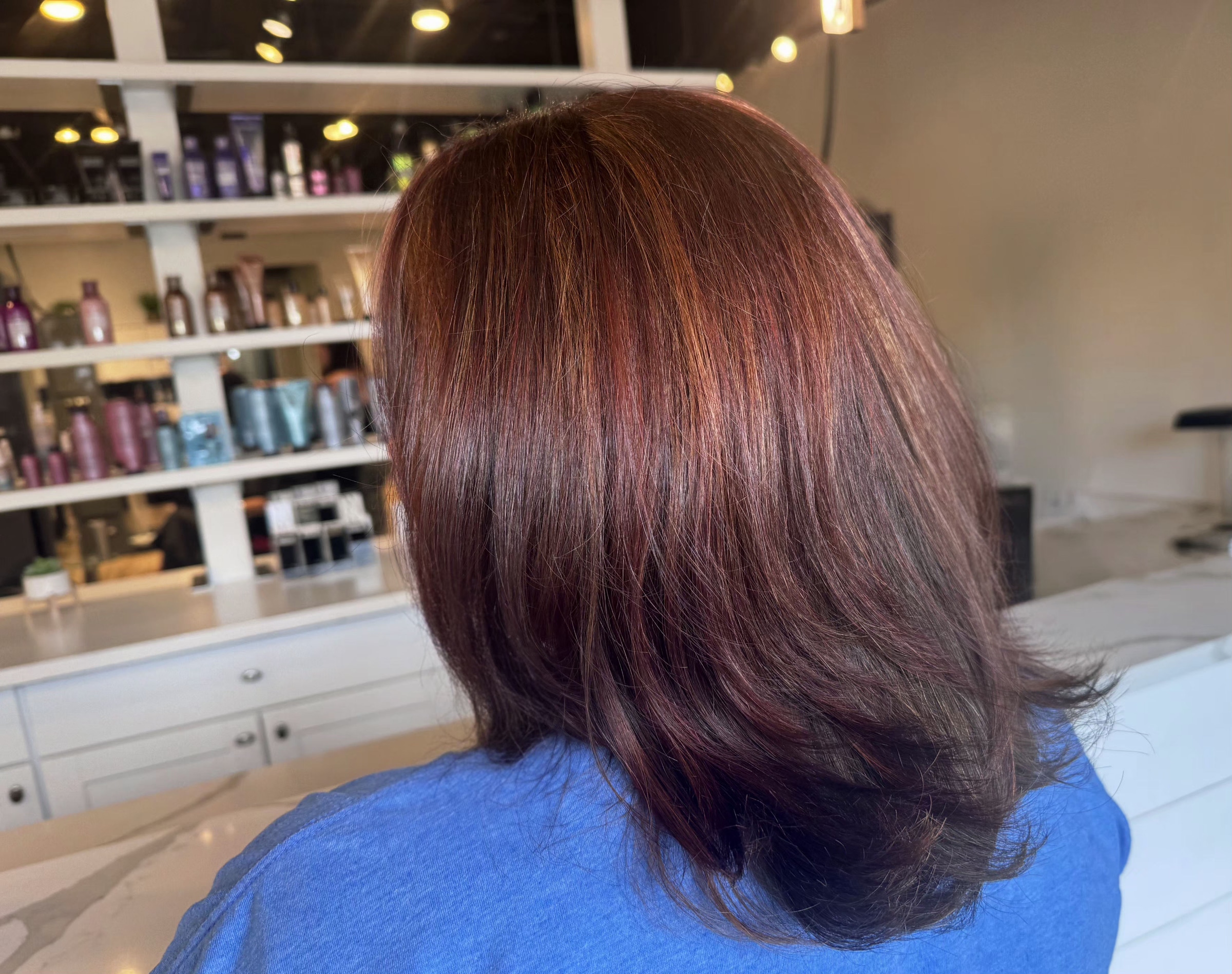 Precision haircut shaped around the client's face — hair by Lili Barker in Leander, TX